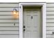 Close-up of a cozy front door with a vintage-style lantern and a clear view of the house number at 380 Kendrick Se Ave, Atlanta, GA 30315