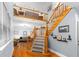 Inviting foyer featuring a staircase with wood railings, hardwood floors, and natural light at 380 Kendrick Se Ave, Atlanta, GA 30315