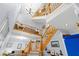 Bright entryway with high ceilings, grand staircase, and wood banister, offering a welcoming ambiance at 380 Kendrick Se Ave, Atlanta, GA 30315