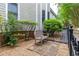 Charming exterior view with a bench, lush greenery, and wrought iron fencing at 380 Kendrick Se Ave, Atlanta, GA 30315