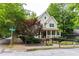 Charming home with a welcoming porch, manicured landscaping, and a wrought iron fence at 380 Kendrick Se Ave, Atlanta, GA 30315