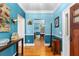 Entryway with hardwood flooring, a console table, and neutral wainscoting at 380 Kendrick Se Ave, Atlanta, GA 30315