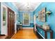 Bright foyer with blue walls, hardwood floors, and elegant decor at 380 Kendrick Se Ave, Atlanta, GA 30315