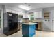 Updated kitchen with stainless steel appliances, granite counters, and a blue kitchen island at 380 Kendrick Se Ave, Atlanta, GA 30315