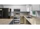 Modern kitchen featuring granite countertops, stainless steel appliances, and white cabinets at 380 Kendrick Se Ave, Atlanta, GA 30315