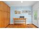 Kitchen featuring light blue walls, hardwood floors, and a wooden storage console with microwave at 380 Kendrick Se Ave, Atlanta, GA 30315