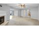 Spacious living room with fireplace, view to backyard, and stairway to second level at 380 Kendrick Se Ave, Atlanta, GA 30315