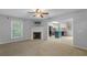 Open living room with fireplace and view into kitchen with blue island at 380 Kendrick Se Ave, Atlanta, GA 30315