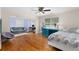 Spacious main bedroom boasts hardwood floors, ensuite sitting area and comfortable decor at 380 Kendrick Se Ave, Atlanta, GA 30315
