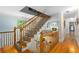Upstairs hallway with a wooden staircase and railing overlooking the living space below at 380 Kendrick Se Ave, Atlanta, GA 30315