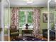Bright study with large windows and door, complemented by vibrant curtains and a stylish patterned rug at 380 Kendrick Se Ave, Atlanta, GA 30315