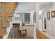 Second floor landing featuring a wooden railing overlooking the living area at 380 Kendrick Se Ave, Atlanta, GA 30315