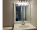 Bathroom featuring vanity with sleek mirror, modern faucet and stylish lighting at 486 Victoria Rd, Woodstock, GA 30189