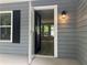 A view of the house through the open front door, with an inviting glimpse of the interior at 486 Victoria Rd, Woodstock, GA 30189