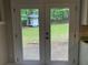 Kitchen doors opening to the backyard and a shed at 486 Victoria Rd, Woodstock, GA 30189