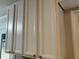 Neutral colored kitchen cabinets with dark hardware, providing a classic look at 486 Victoria Rd, Woodstock, GA 30189