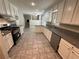Spacious kitchen with stainless steel appliances, granite counters, and tile flooring at 486 Victoria Rd, Woodstock, GA 30189