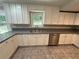 A functional kitchen featuring granite countertops, stainless steel appliances and ample cabinet storage at 486 Victoria Rd, Woodstock, GA 30189