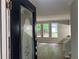 A view of the living room through the front door, with wood floors and natural light at 486 Victoria Rd, Woodstock, GA 30189