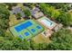 Community aerial view showcasing tennis courts, pool, playground, and clubhouse, great for active living at 1125 Harvest Brook Way, Lawrenceville, GA 30043