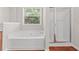 Bathroom with a bathtub and separate glass-enclosed shower stall at 1125 Harvest Brook Way, Lawrenceville, GA 30043