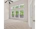 Bright bedroom with a high ceiling and several large windows at 1125 Harvest Brook Way, Lawrenceville, GA 30043