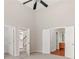 Spacious bedroom leading to ensuite bath with high ceilings and fan at 1125 Harvest Brook Way, Lawrenceville, GA 30043
