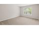 Comfortable bedroom with a large window offering plenty of natural light at 1125 Harvest Brook Way, Lawrenceville, GA 30043