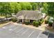 Aerial view of the clubhouse with parking and landscaping at 1125 Harvest Brook Way, Lawrenceville, GA 30043