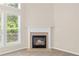 Close up view of a gas fireplace with a white mantel at 1125 Harvest Brook Way, Lawrenceville, GA 30043