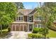 Charming two-story home featuring a two-car garage and beautifully landscaped front yard at 1125 Harvest Brook Way, Lawrenceville, GA 30043