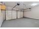 Spacious garage with dual doors and a sealed concrete floor at 1125 Harvest Brook Way, Lawrenceville, GA 30043