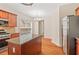 Kitchen with granite countertops, a center island, and stainless steel appliances at 1125 Harvest Brook Way, Lawrenceville, GA 30043