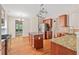 Spacious kitchen with granite countertops, a center island, and stainless steel appliances at 1125 Harvest Brook Way, Lawrenceville, GA 30043