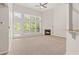 Bright living room featuring a fireplace, vaulted ceiling, and many windows at 1125 Harvest Brook Way, Lawrenceville, GA 30043