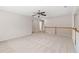 Open loft space with carpet flooring, offering flexible living area at 1125 Harvest Brook Way, Lawrenceville, GA 30043