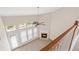 An Open loft with natural light, a fireplace, and a ceiling fan at 1125 Harvest Brook Way, Lawrenceville, GA 30043