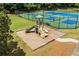 Playground area with slide and climbing structure nestled next to tennis courts, and walking path at 1125 Harvest Brook Way, Lawrenceville, GA 30043