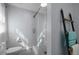 Modern bathroom showcases gray walls, glass shower, and ladder-style towel rack at 1493 Martin Nash Sw Rd, Lilburn, GA 30047