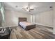 Spacious bedroom offers ceiling fan, wood floors, and lots of natural light at 1493 Martin Nash Sw Rd, Lilburn, GA 30047