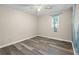 Bedroom with luxury vinyl plank flooring, ceiling fan and natural light at 1493 Martin Nash Sw Rd, Lilburn, GA 30047