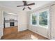 Dining room showcases wood floors, bright windows, and adjacent access to the kitchen at 1493 Martin Nash Sw Rd, Lilburn, GA 30047