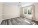 Dining room with neutral walls, wood-look floors, and a modern chandelier at 1493 Martin Nash Sw Rd, Lilburn, GA 30047