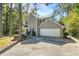 Charming two-story home with a two-car garage, well-maintained landscaping, and a welcoming front porch at 1493 Martin Nash Sw Rd, Lilburn, GA 30047