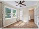 Cozy living room with wood flooring, natural lighting and access to an outdoor deck at 1493 Martin Nash Sw Rd, Lilburn, GA 30047