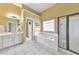 Bright bathroom with a tub, a separate shower, and a vanity with double sinks at 1730 Millhouse Run, Marietta, GA 30066