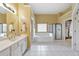Bathroom with double sinks, tub and separate shower with a view to the walk in closet at 1730 Millhouse Run, Marietta, GA 30066