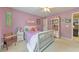 Bedroom featuring a ceiling fan and ample natural light at 1730 Millhouse Run, Marietta, GA 30066