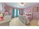 Bright bedroom with a ceiling fan, great natural light, and stylish décor at 1730 Millhouse Run, Marietta, GA 30066