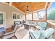 Cozy covered deck featuring outdoor seating, ceiling fan, and natural lighting at 1730 Millhouse Run, Marietta, GA 30066